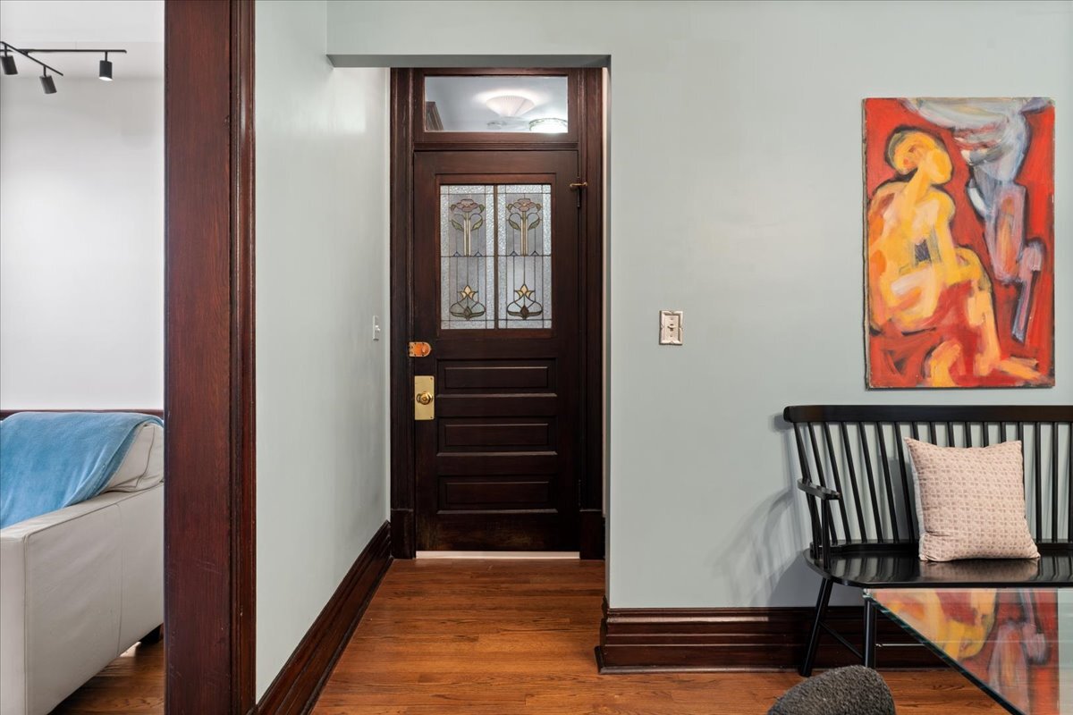 1946 North Seminary Avenue, Unit 1 Chicago, IL 60614 - Photo 2 of 20 a view of a hallway with wooden floor and stairs