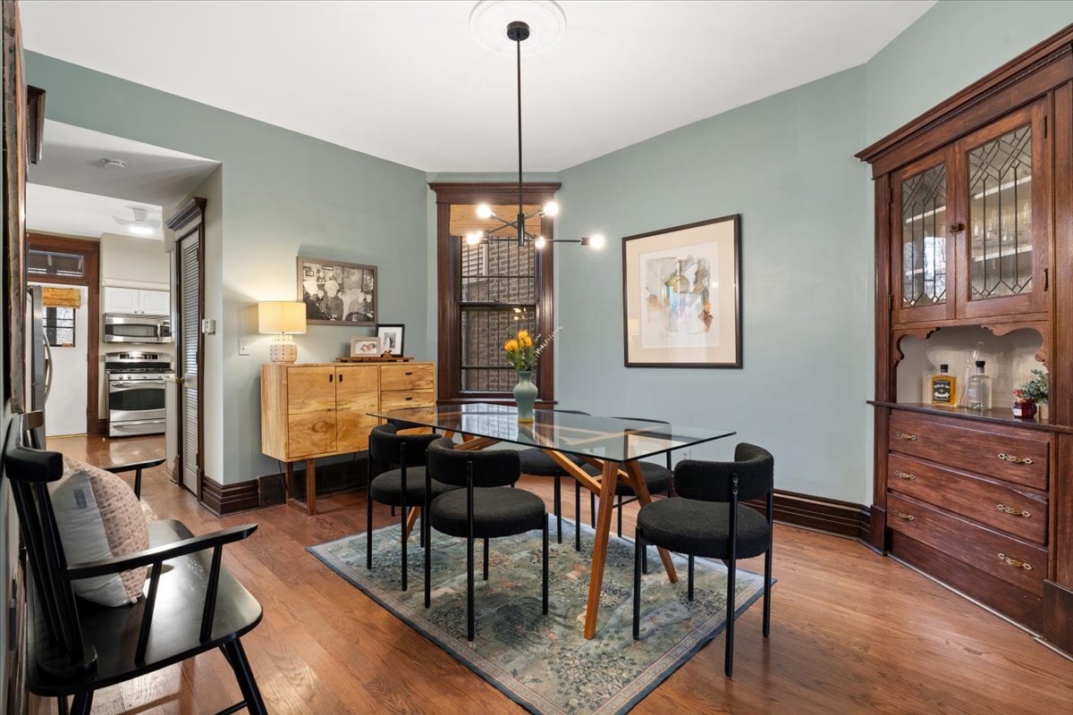 1946 North Seminary Avenue, Unit 1 Chicago, IL 60614 - Photo 4 of 20 a view of a dining room with furniture window and wooden floor
