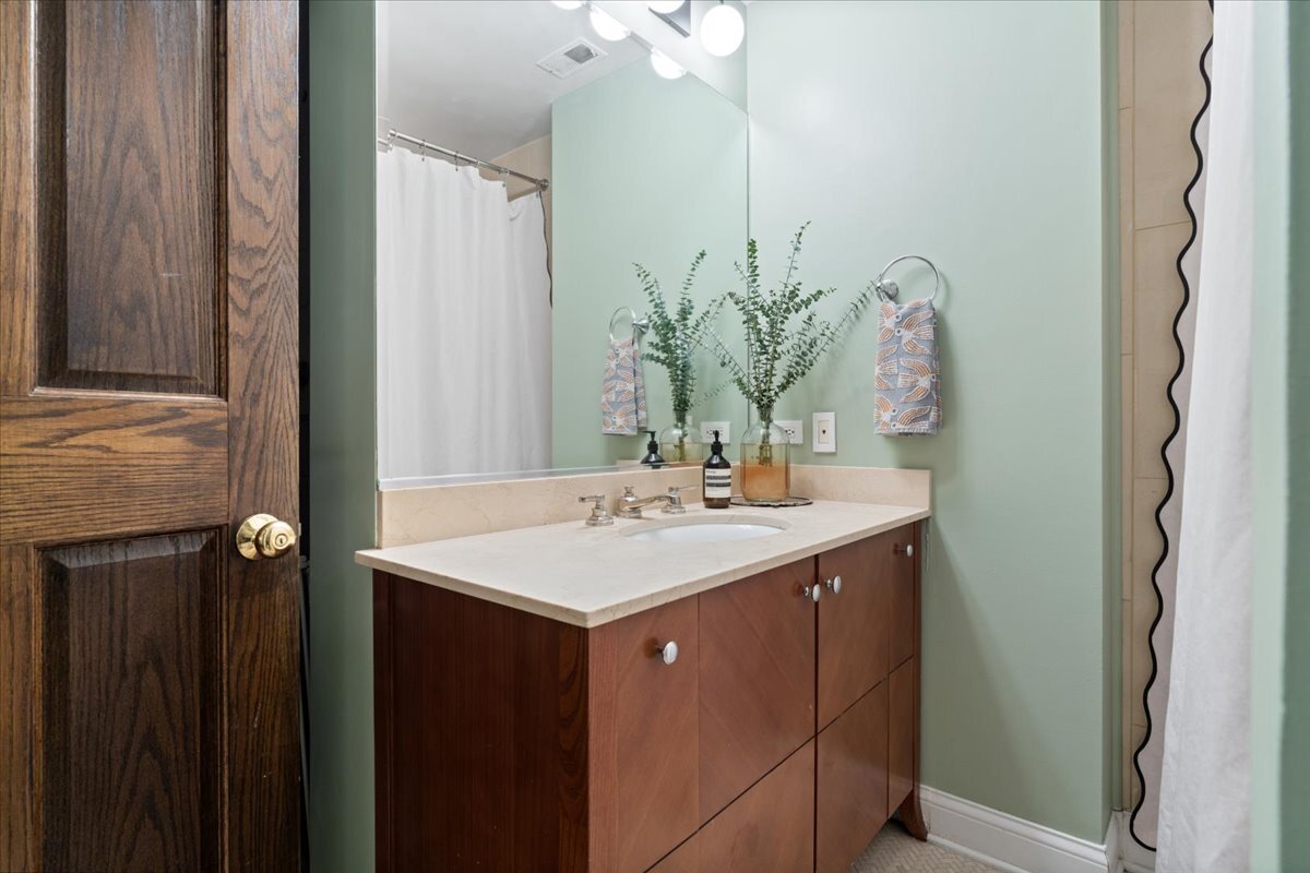 1946 North Seminary Avenue, Unit 1 Chicago, IL 60614 - Photo 9 of 20 a bathroom with a sink and a mirror