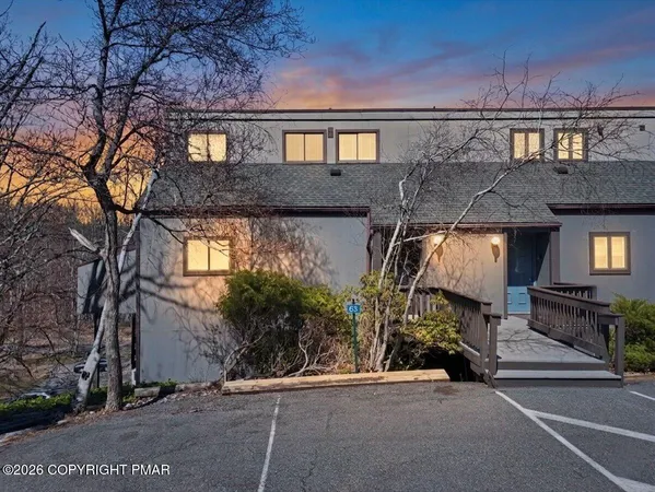 a view of a car park in front of house