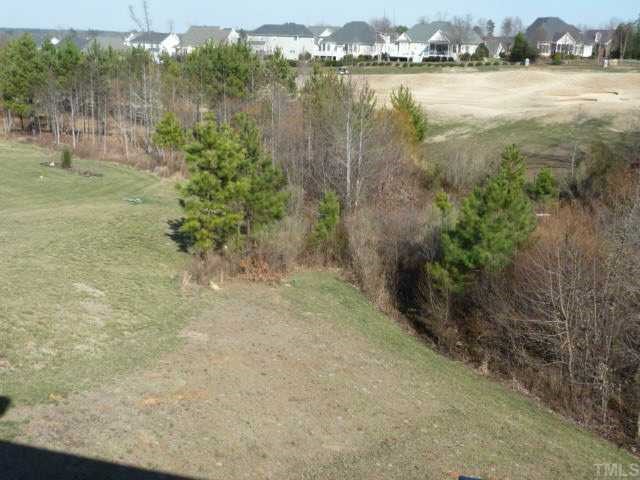648 Seastone Street Raleigh, NC 27603 - Photo 11 of 12 Backyard with view of golf course
