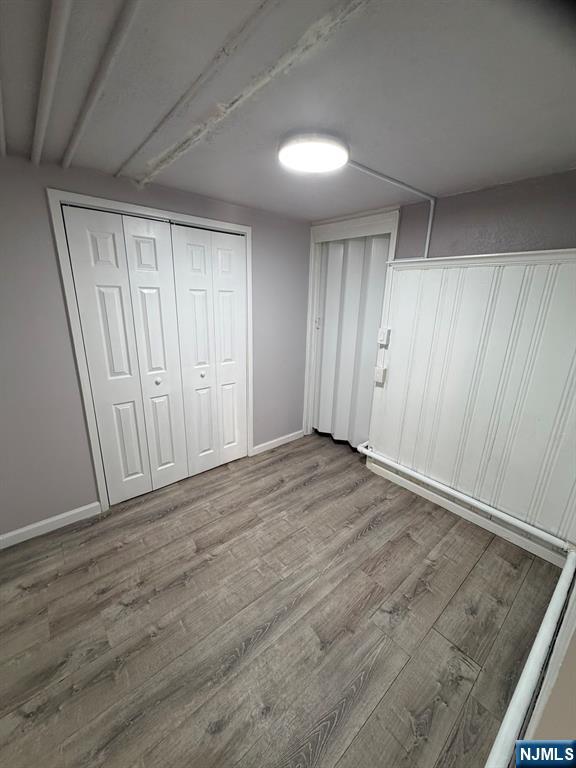 1283 Valley Road, Unit 7 Montclair, NJ 07043 - Photo 15 of 26 an empty room with wooden floor