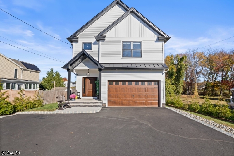 574 Ridgedale Avenue East Hanover, NJ 07936 - Photo 1 of 35 a front view of a house with a yard and garage