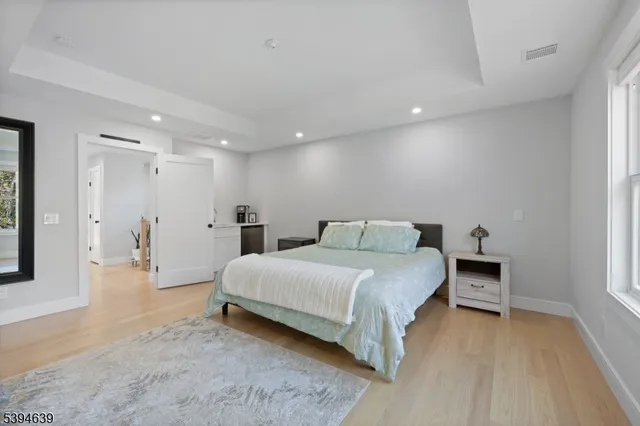 a bathroom with a double vanity sink mirror double shower and toilet
