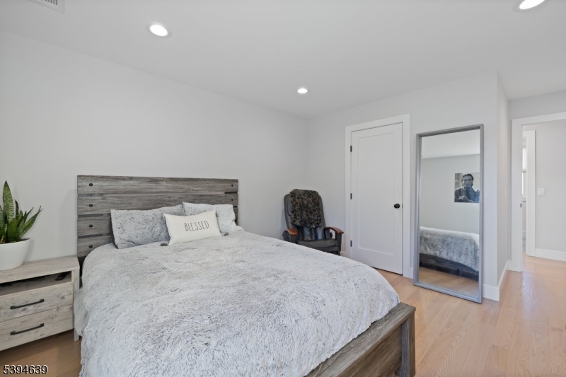 574 Ridgedale Avenue East Hanover, NJ 07936 - Photo 23 of 35 a bedroom with a bed and a potted plant