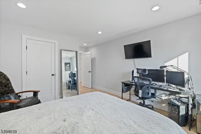 a view of a house with a yard patio and fire pit