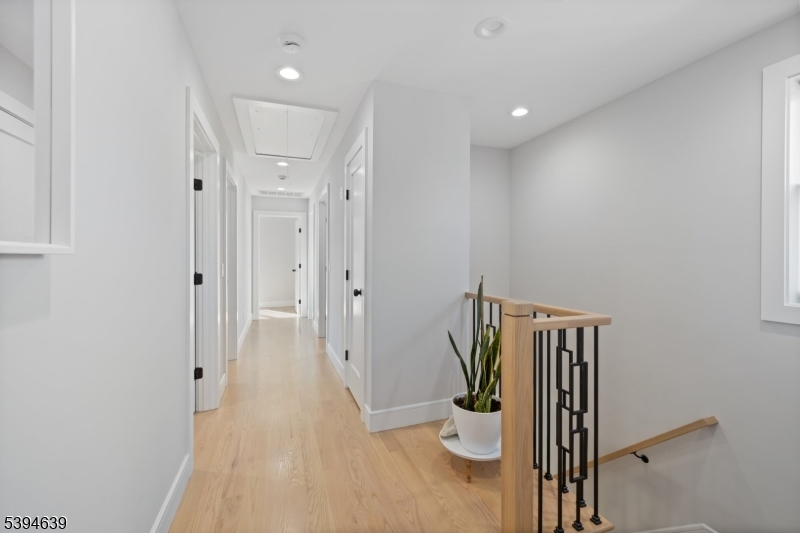 574 Ridgedale Avenue East Hanover, NJ 07936 - Photo 28 of 35 a view of a hallway with wooden floor and entryway