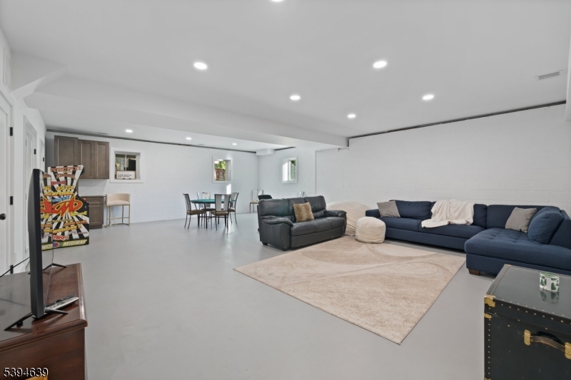 574 Ridgedale Avenue East Hanover, NJ 07936 - Photo 30 of 35 a living room with furniture and wooden floor