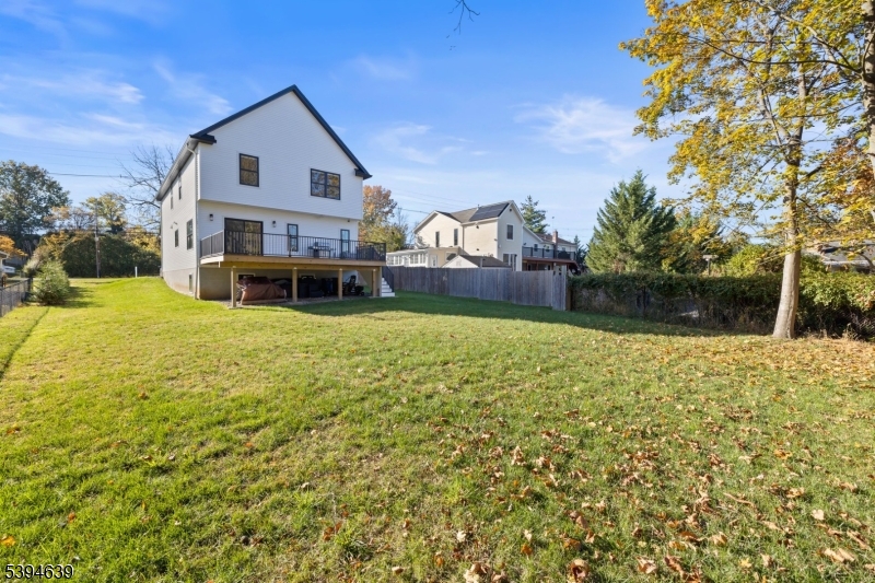 574 Ridgedale Avenue East Hanover, NJ 07936 - Photo 35 of 35 a view of a house with a yard patio and fire pit