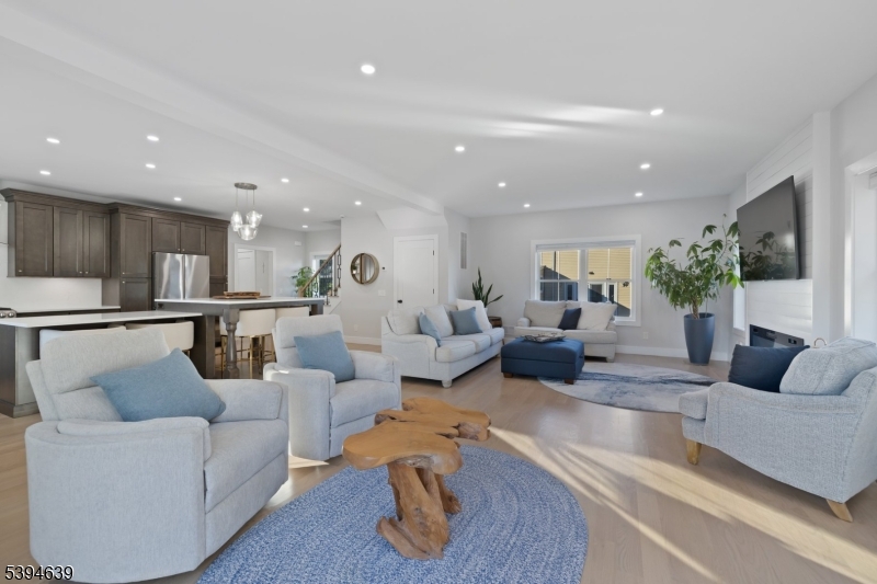 574 Ridgedale Avenue East Hanover, NJ 07936 - Photo 7 of 35 a living room with furniture wooden floor and a kitchen view