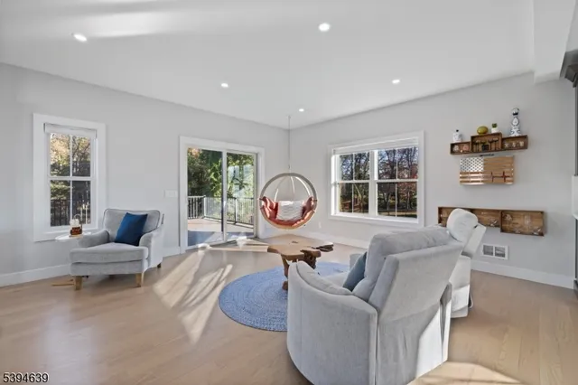 a spacious bedroom with a large bed and a large window