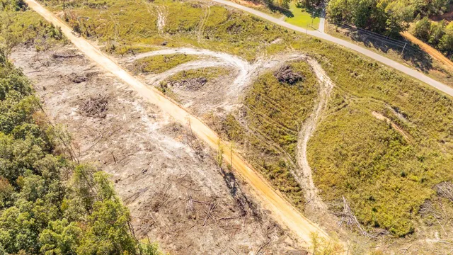 a view of a town with mountains in the background