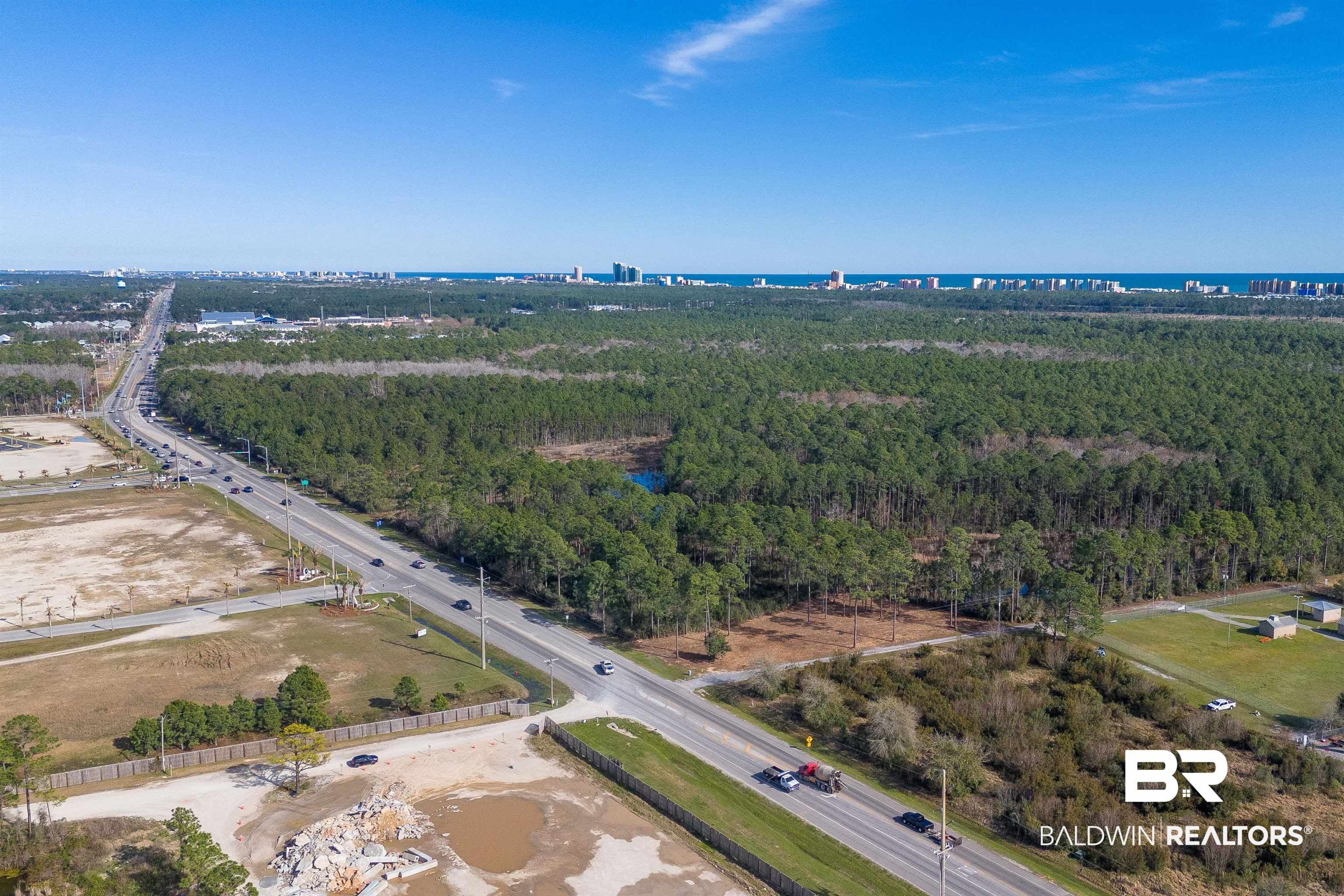 0 Canal Road Orange Beach, AL 36561 - Photo 14 of 25 Drone / aerial view featuring a forest view and a water view