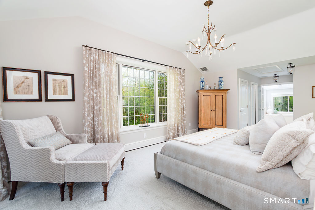 9 Green Lane Ridgefield, CT 06877 - Photo 17 of 40 a bedroom with a bed couch and window