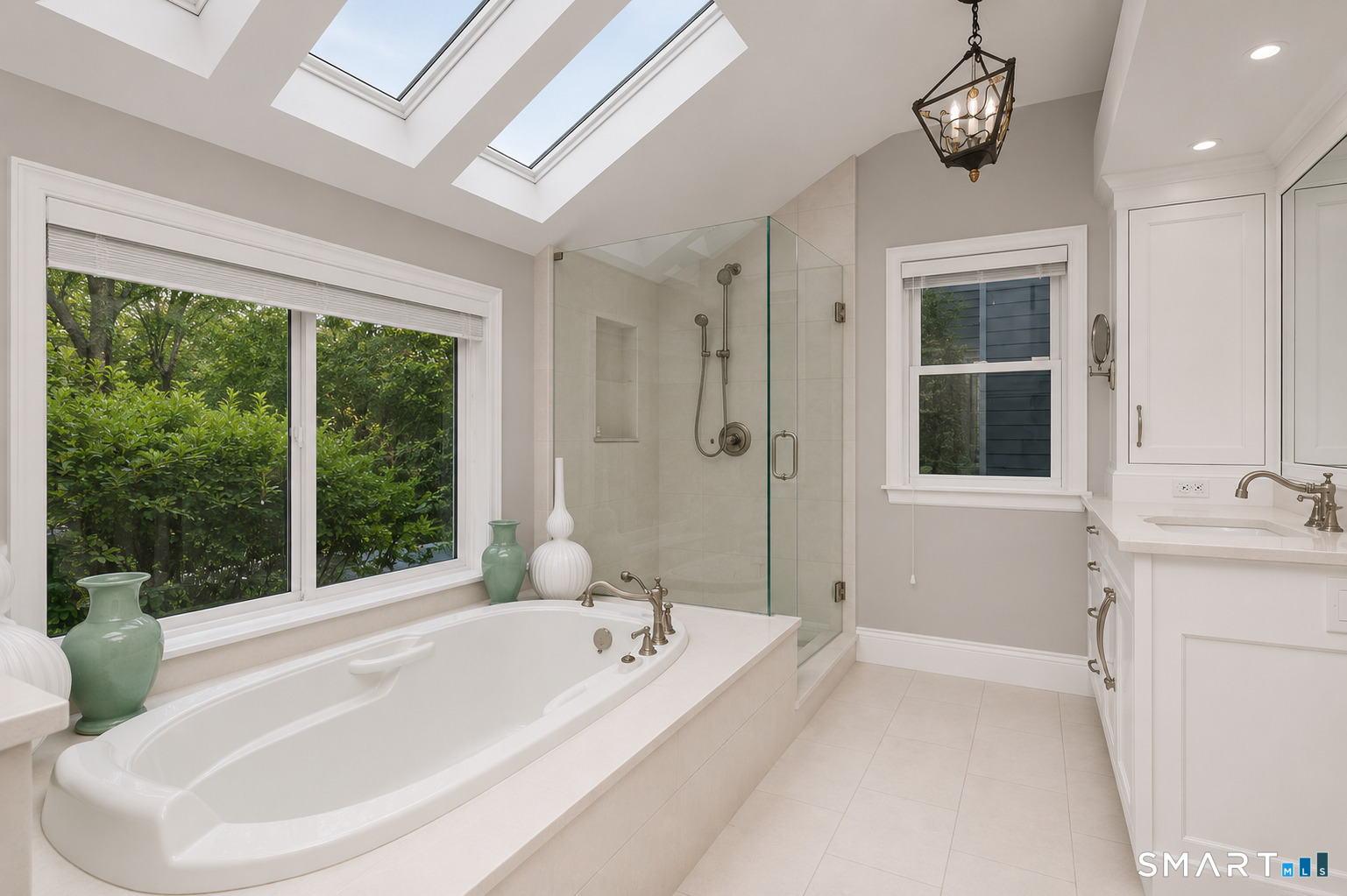 9 Green Lane Ridgefield, CT 06877 - Photo 19 of 40 a bathroom with a tub sink and window