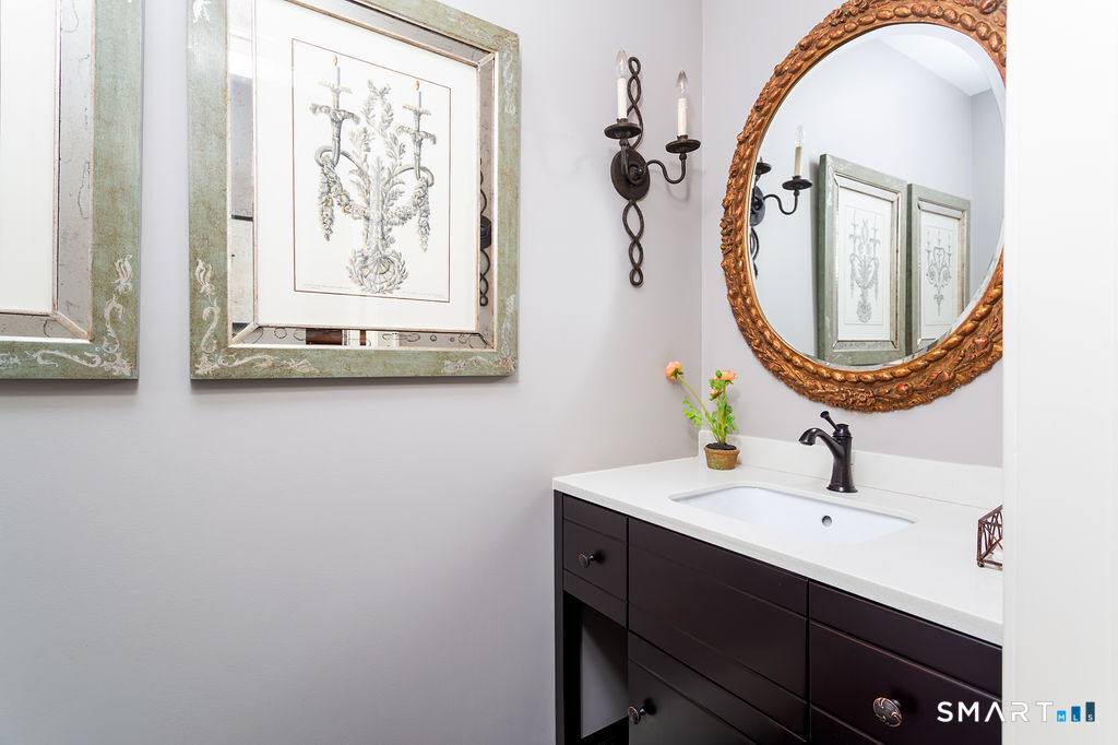 9 Green Lane Ridgefield, CT 06877 - Photo 20 of 40 a bathroom with a sink and a mirror