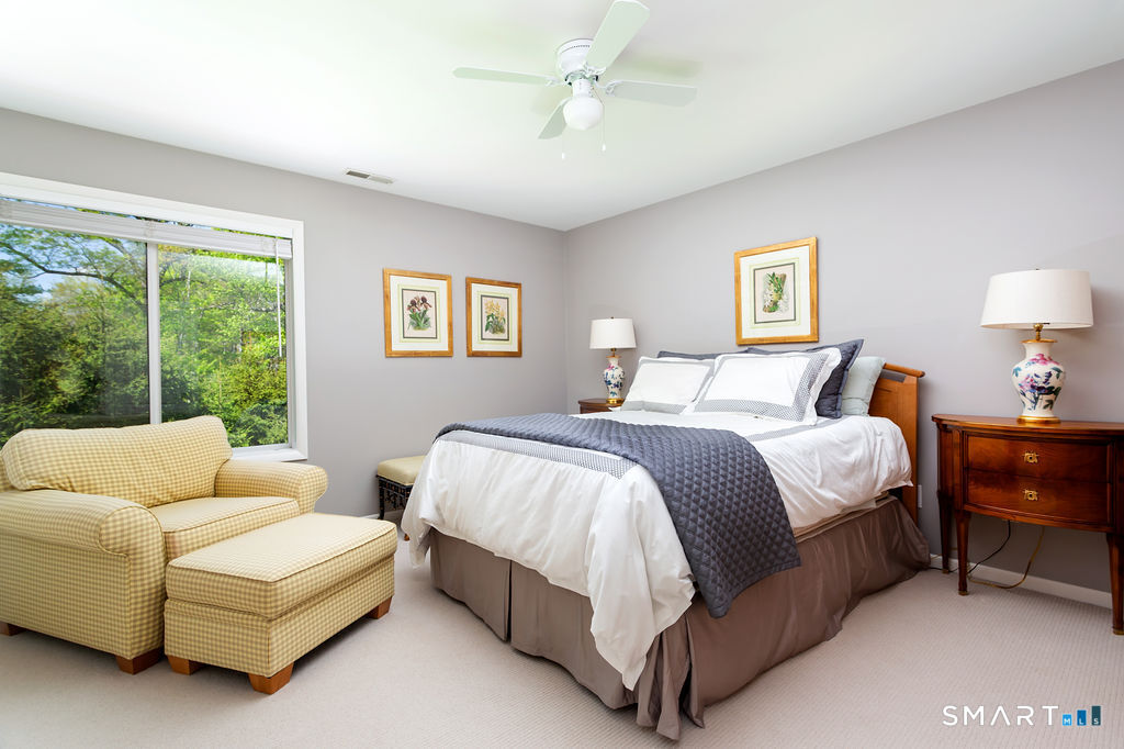 9 Green Lane Ridgefield, CT 06877 - Photo 25 of 40 a bedroom with a bed couch and a window