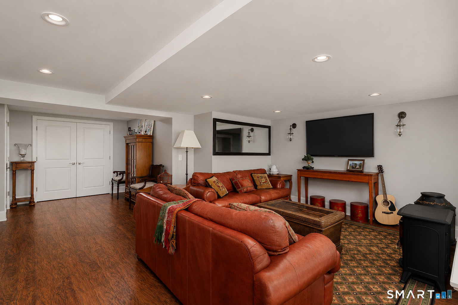 9 Green Lane Ridgefield, CT 06877 - Photo 28 of 40 a living room with furniture and a flat screen tv