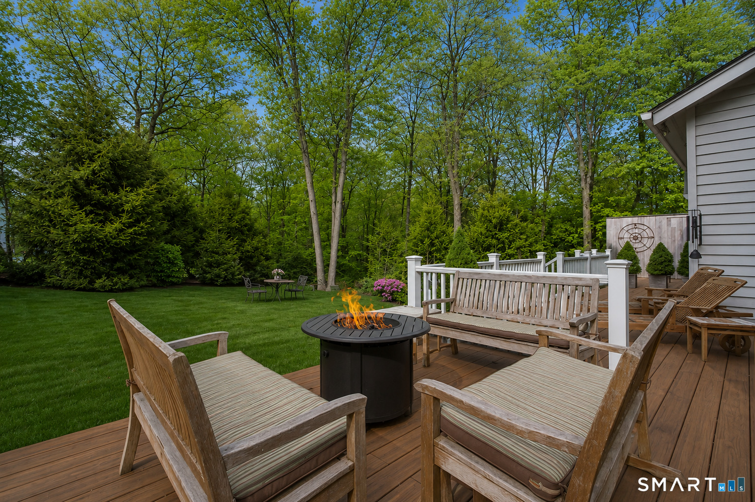 9 Green Lane Ridgefield, CT 06877 - Photo 32 of 40 a view of a deck with chairs and a yard