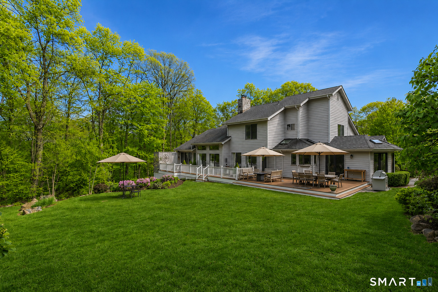 9 Green Lane Ridgefield, CT 06877 - Photo 35 of 40 a front view of a house with garden