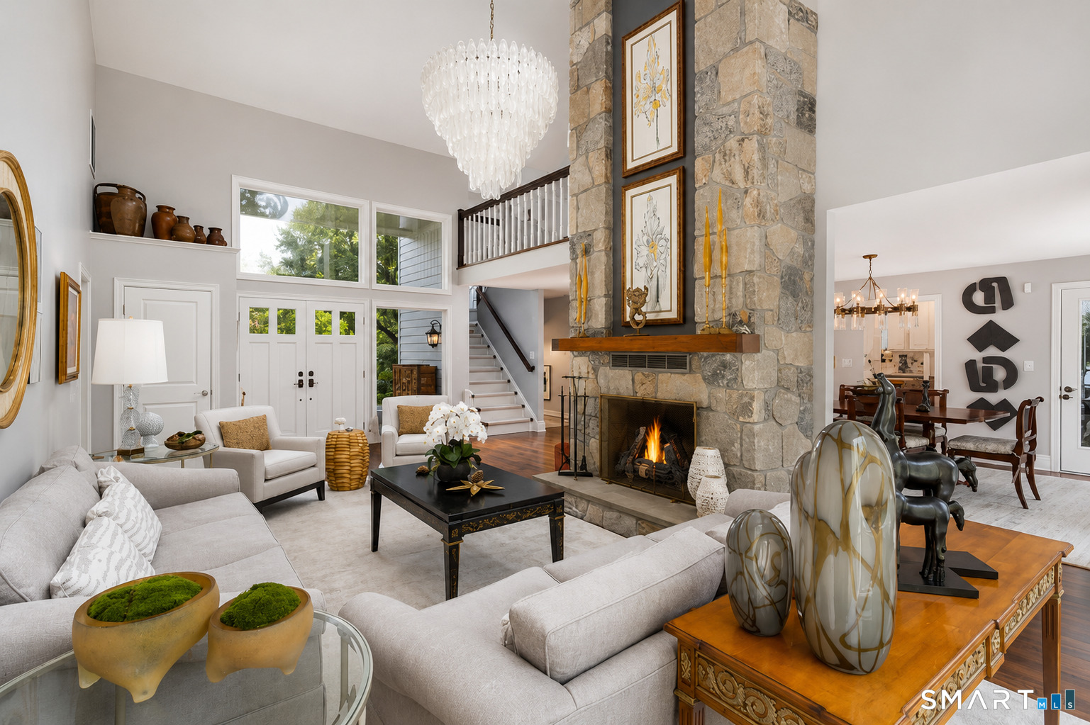 9 Green Lane Ridgefield, CT 06877 - Photo 5 of 40 a living room with furniture a fireplace and a chandelier