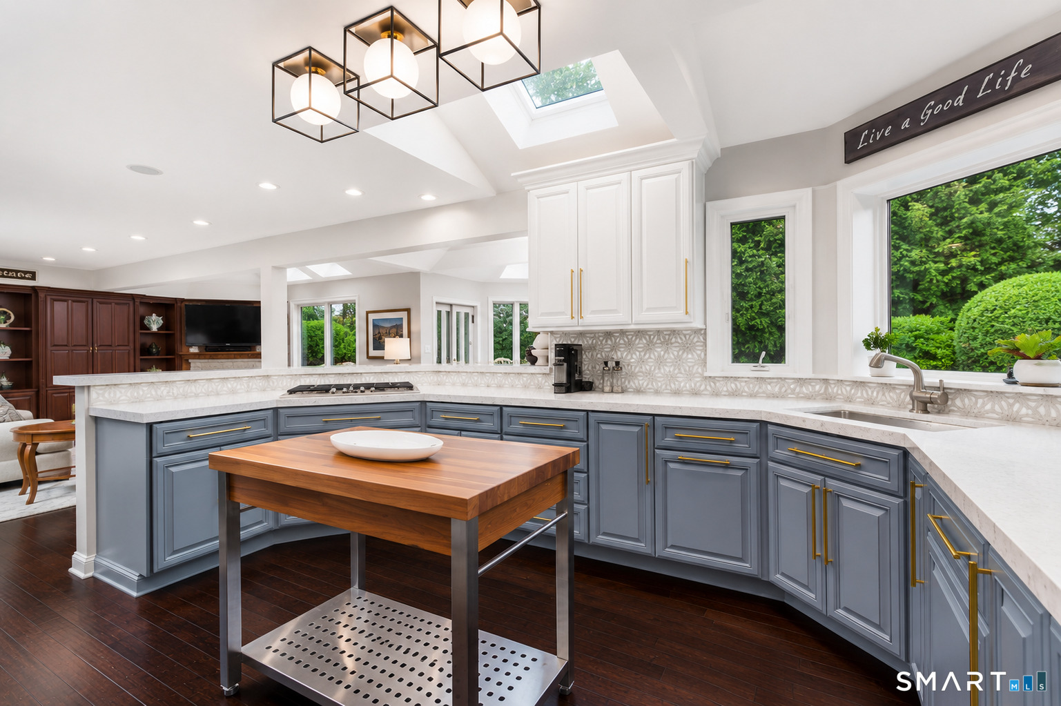 9 Green Lane Ridgefield, CT 06877 - Photo 7 of 40 a kitchen with a table chairs sink and cabinets