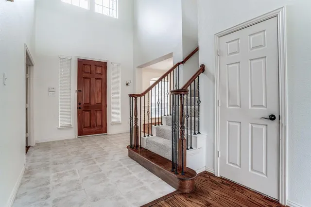 a view of a hallway with entryway door