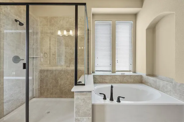 a bathroom with a sink a granite counter and a mirror