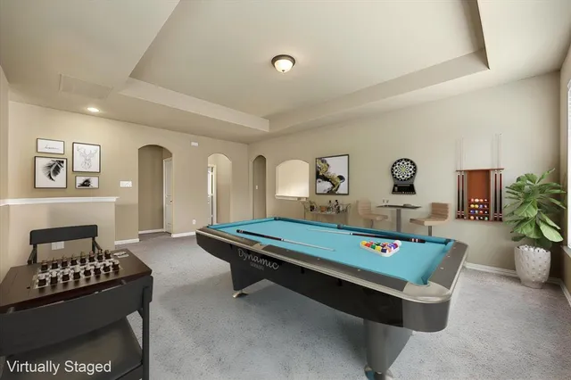 a living room with furniture a lamp and a table