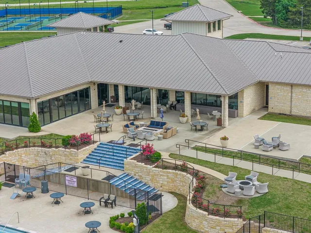an aerial view of a house with a lake view