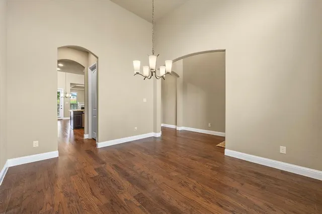a view of a room with wooden floor