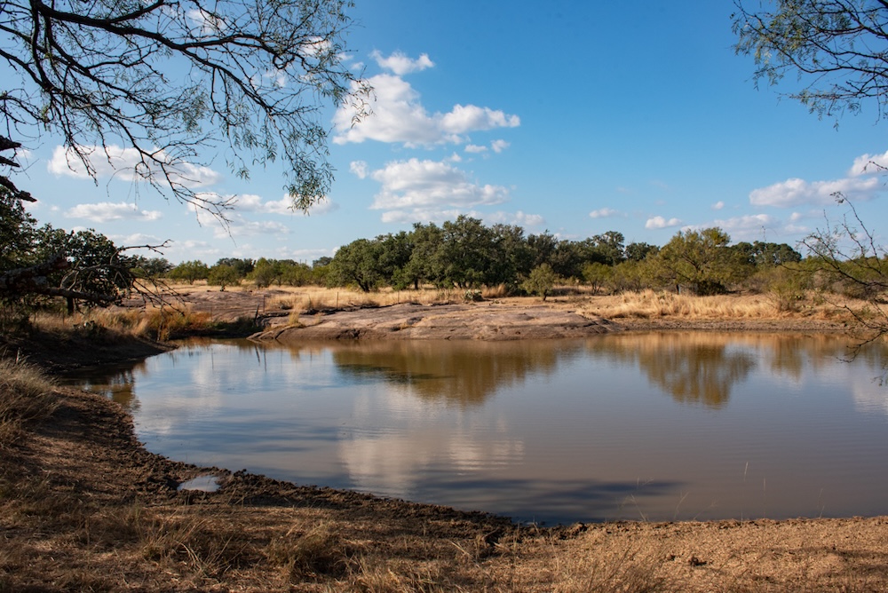 Undisclosed Address Rocksprings, TX 78880 - Photo 10 of 12 a view of a lake with houses