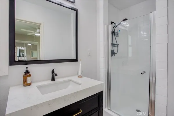 a bathroom with a sink and mirror
