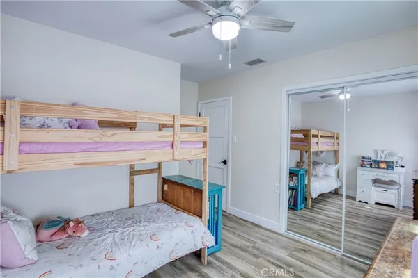 a bedroom with a bed and closet