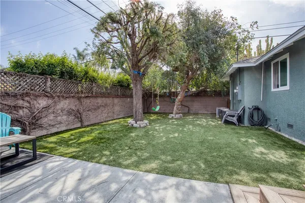 a backyard of a house with seating space