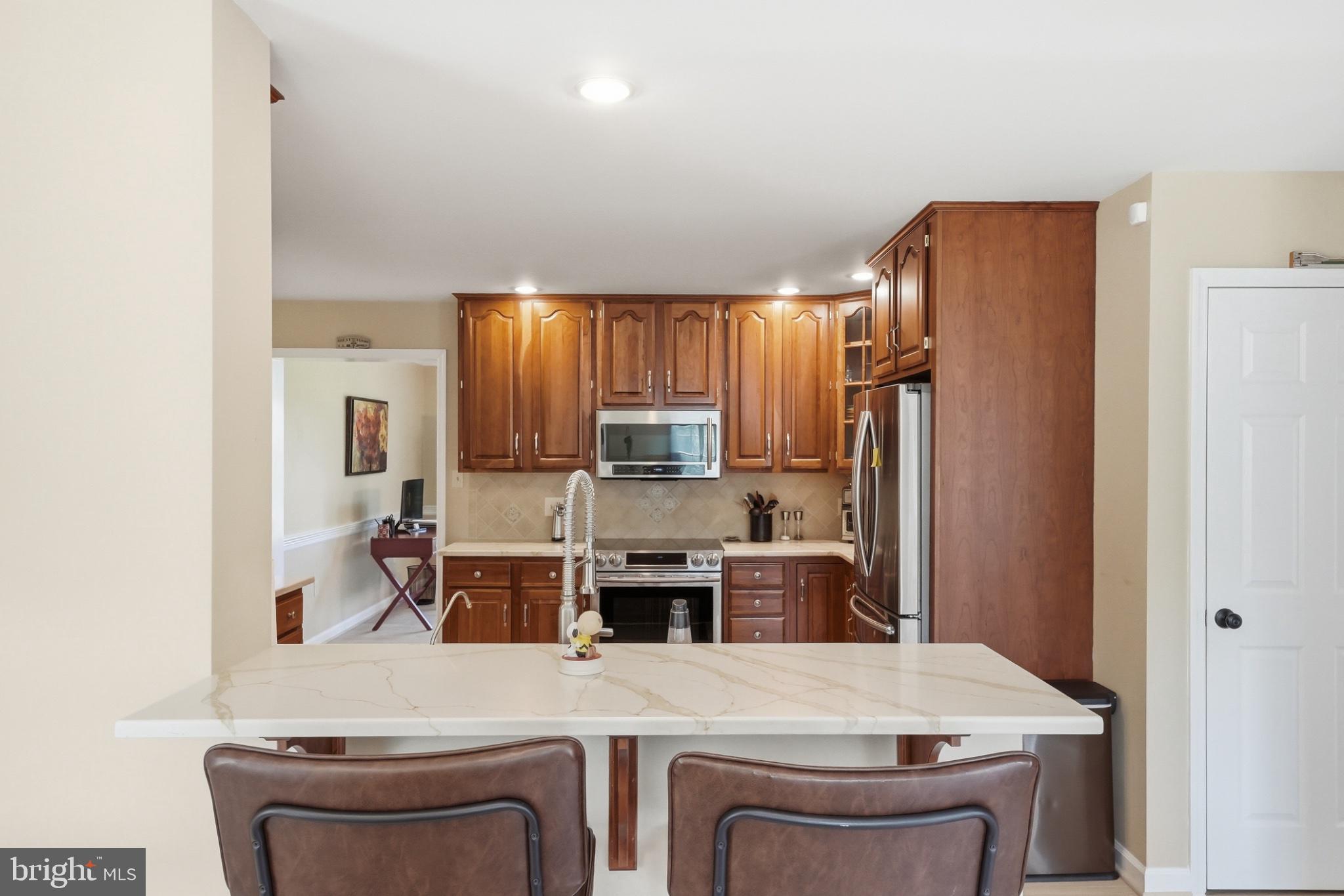 11337 Old Stillhouse Road Boston, VA 22713 - Photo 23 of 58 a kitchen with stainless steel appliances a refrigerator and a stove top oven