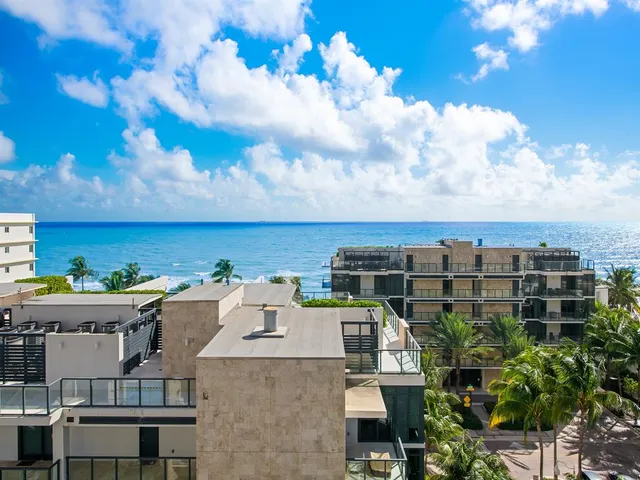 a view of a swimming pool and lounge chairs