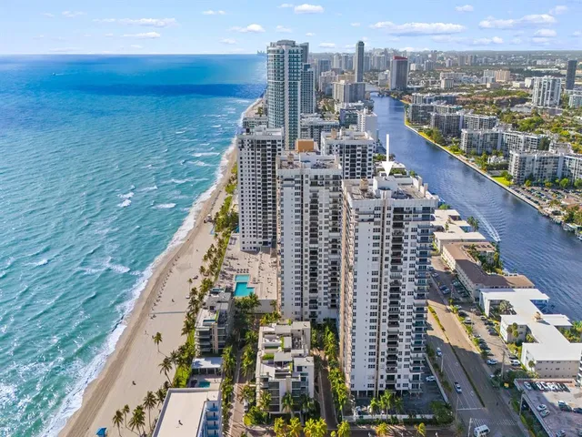 a view of a swimming pool with a yard