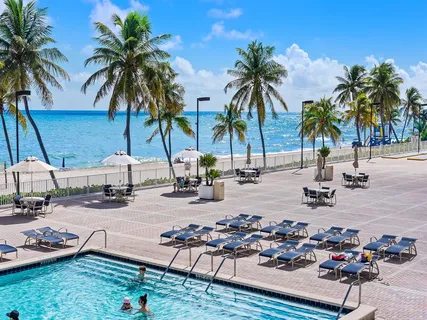 a view of a terrace with a garden and trees