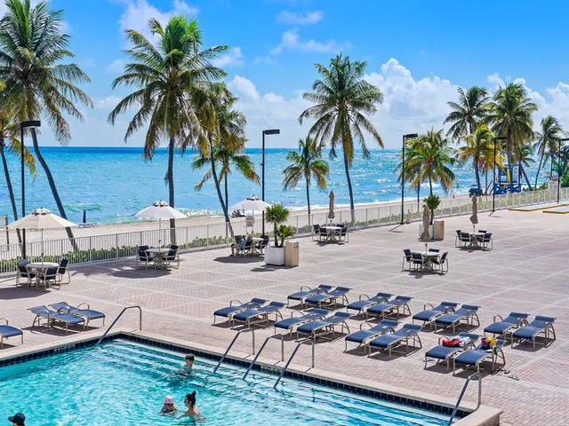a view of a terrace with a garden and trees