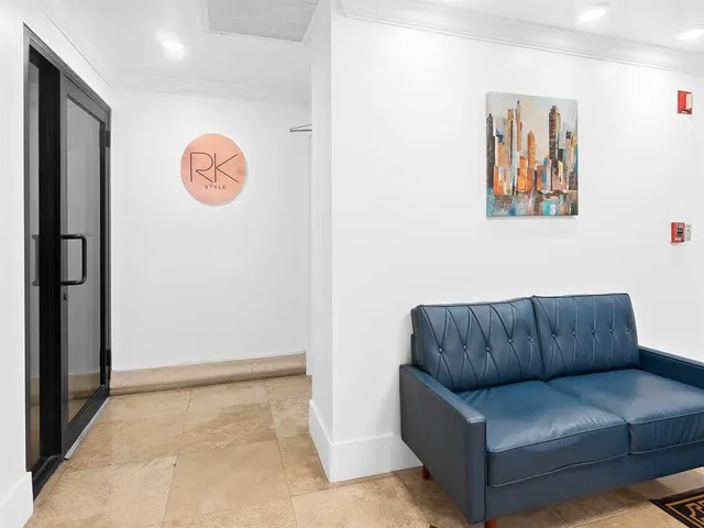 a large open kitchen with a table and chairs in it