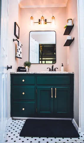 a bedroom with bed and a book shelf