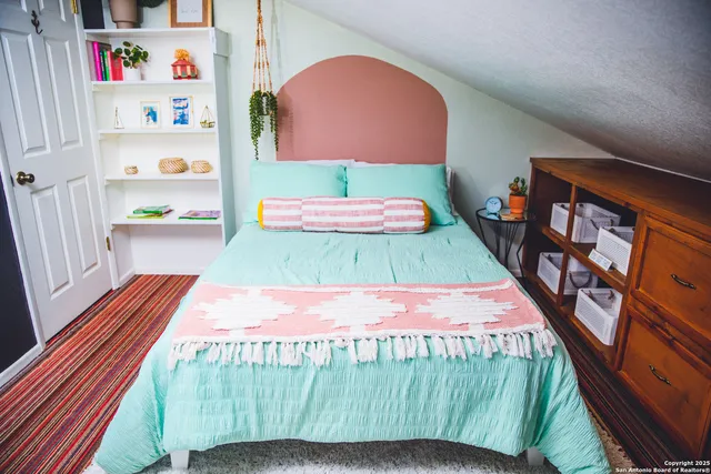 a bathroom with a shower a toilet and a sink