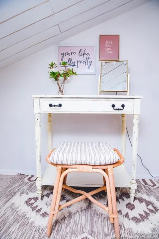 a bathroom with a sink vanity and a mirror