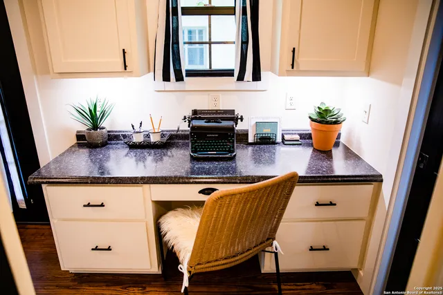 a view of a workspace with furniture