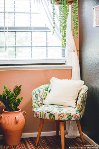 a view of a chairs and table in backyard