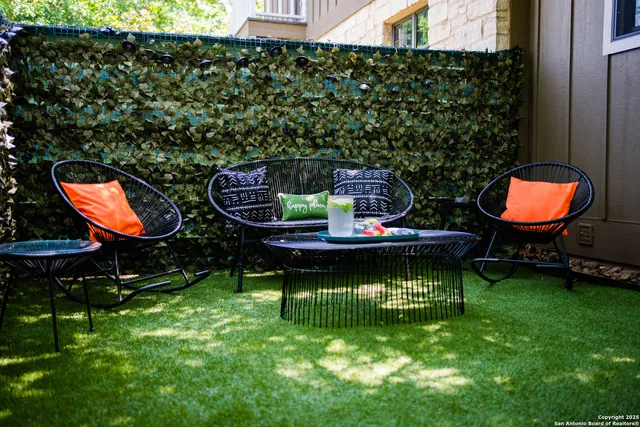 a backyard of a house with barbeque oven