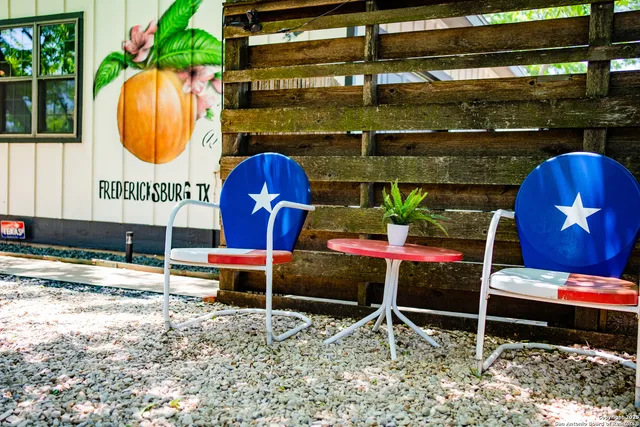 a view of a house with a yard and deck
