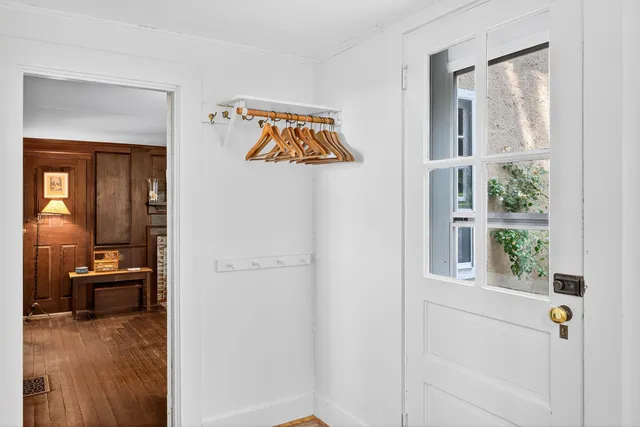 a view of a hallway with paintings on the wall
