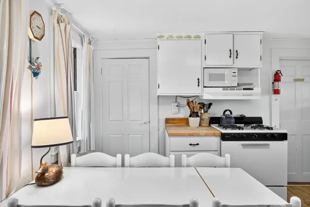 a kitchen with cabinets and appliances